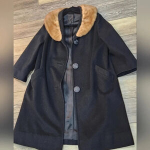 A Birkshire Casual vintage black coat with fur around neck